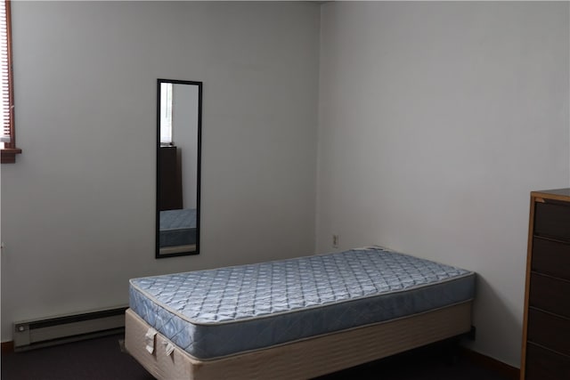 bedroom featuring a baseboard heating unit