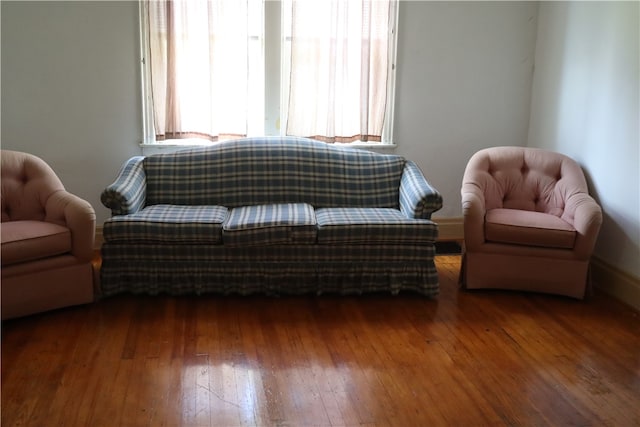 living room with a wealth of natural light and hardwood / wood-style floors