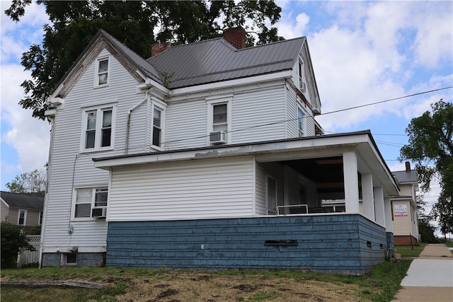 view of front of home featuring cooling unit