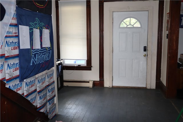 entrance foyer with dark hardwood / wood-style floors and baseboard heating