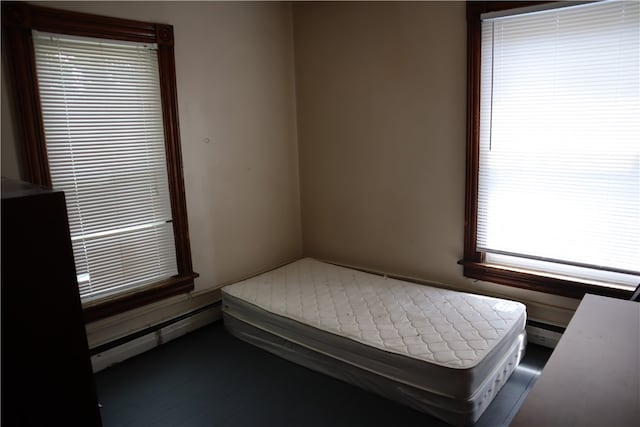 bedroom featuring a baseboard heating unit