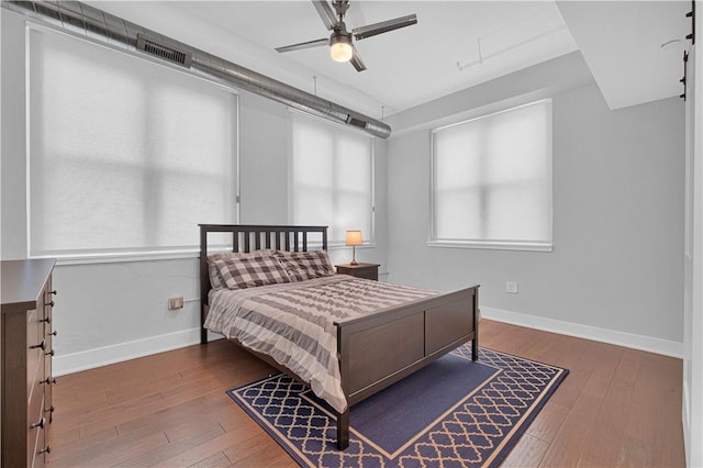 bedroom with hardwood / wood-style floors and ceiling fan