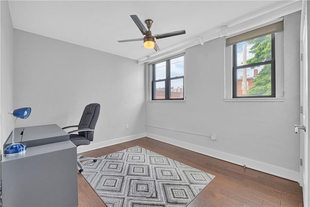 office with ceiling fan, hardwood / wood-style floors, and vaulted ceiling