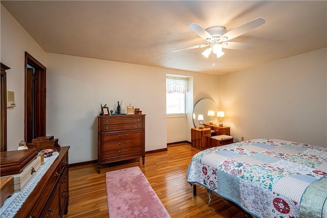 bedroom featuring ceiling fan and light hardwood / wood-style floors