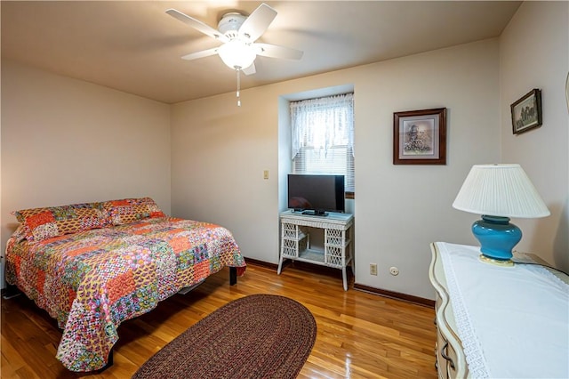 bedroom featuring ceiling fan and hardwood / wood-style floors