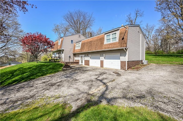 exterior space with a lawn and a garage