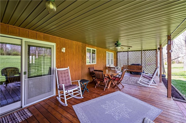 wooden deck featuring ceiling fan