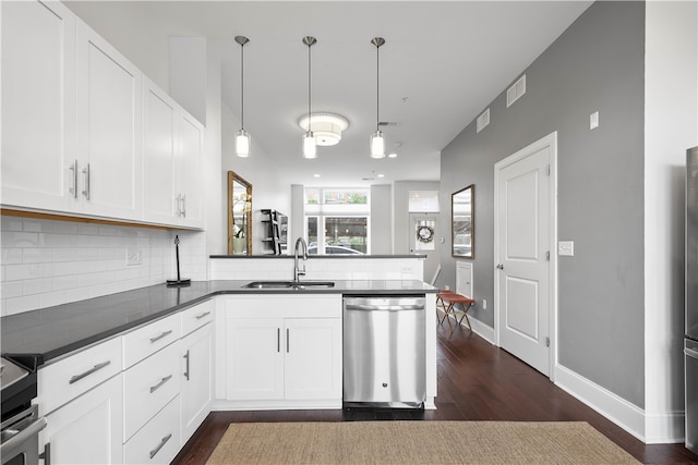 kitchen featuring sink, hanging light fixtures, dishwasher, kitchen peninsula, and white cabinets