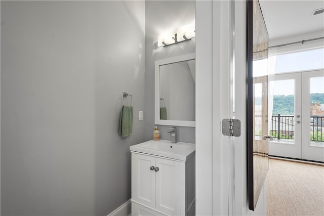 bathroom with vanity and french doors