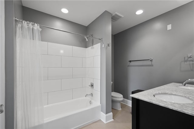 full bathroom with vanity, tile patterned floors, toilet, and shower / bathtub combination with curtain