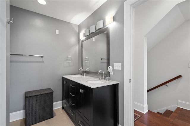 bathroom with vanity and hardwood / wood-style flooring