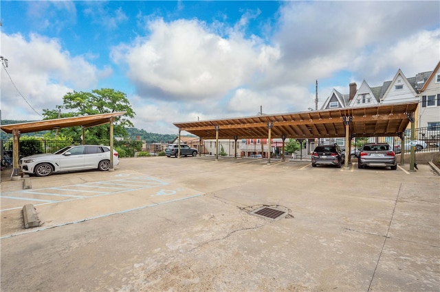 view of vehicle parking featuring a carport