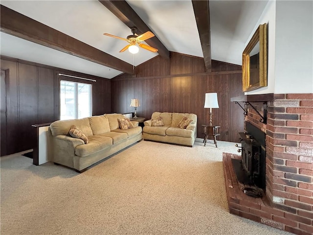 carpeted living room featuring ceiling fan and vaulted ceiling with beams