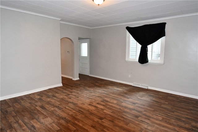 spare room featuring crown molding and dark wood-type flooring