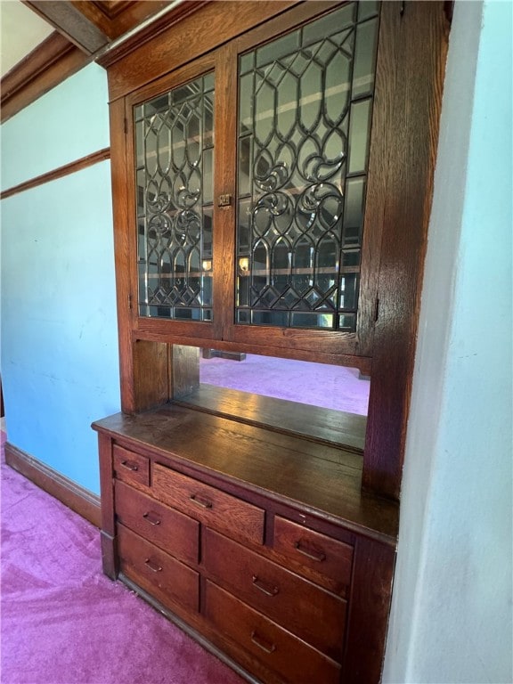 interior details with carpet and indoor bar