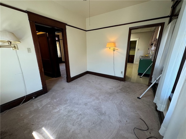 unfurnished room with light carpet