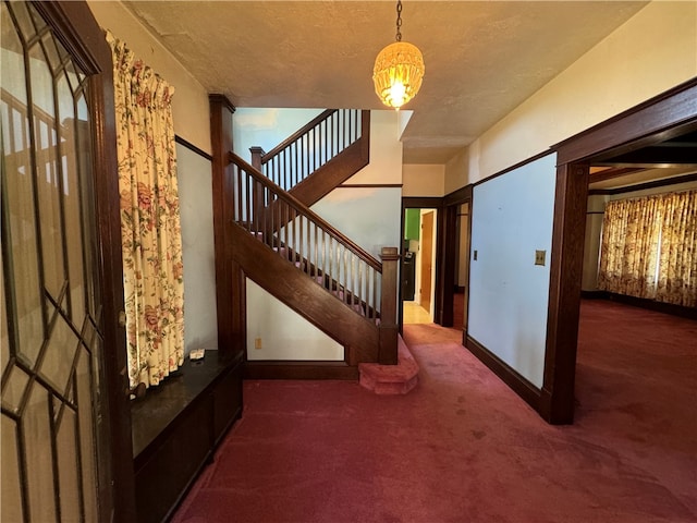 view of carpeted entrance foyer