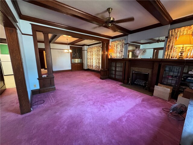 unfurnished living room with beamed ceiling, ceiling fan with notable chandelier, carpet, and ornamental molding