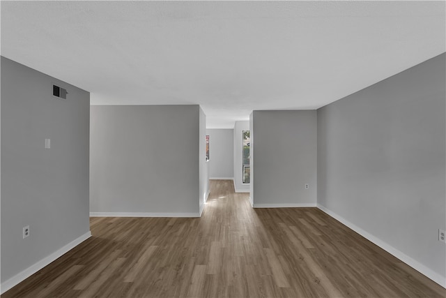 unfurnished room featuring dark hardwood / wood-style floors