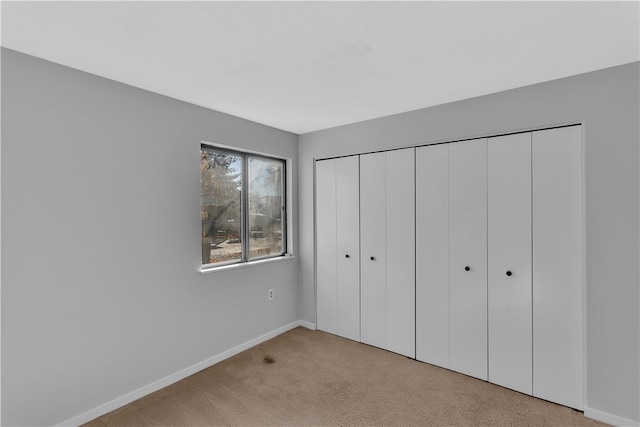 unfurnished bedroom with light carpet