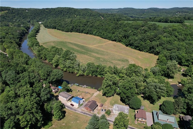 aerial view featuring a water view and a forest view