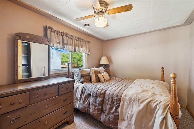 bedroom with carpet, visible vents, and ceiling fan