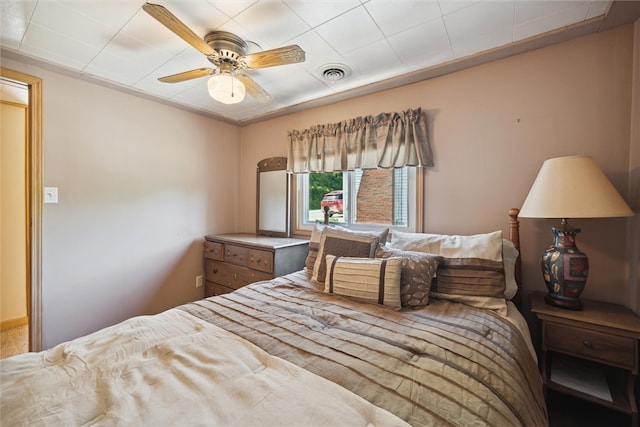 bedroom featuring visible vents and ceiling fan