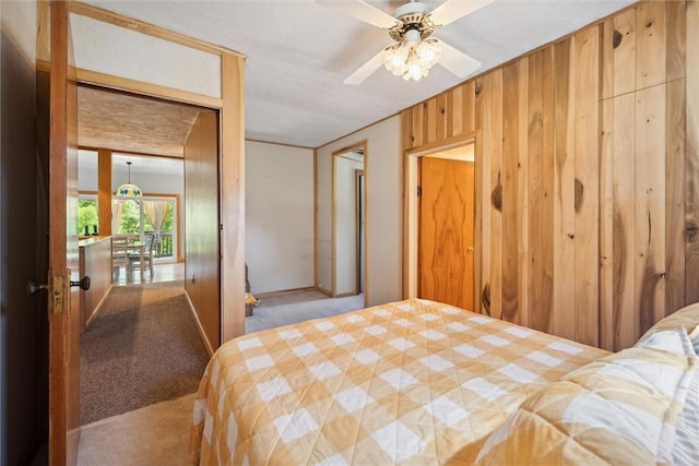 bedroom featuring wood walls