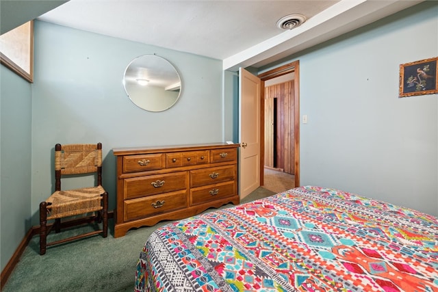 carpeted bedroom featuring visible vents and baseboards