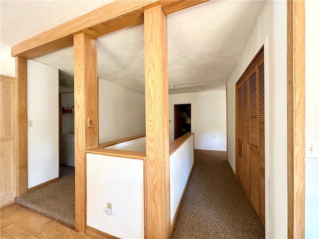 corridor with a textured ceiling