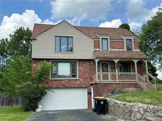 view of front of house featuring a porch and a garage