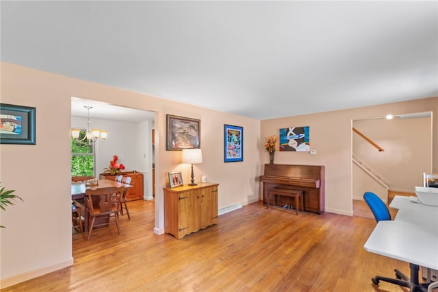 home office featuring a notable chandelier and wood-type flooring