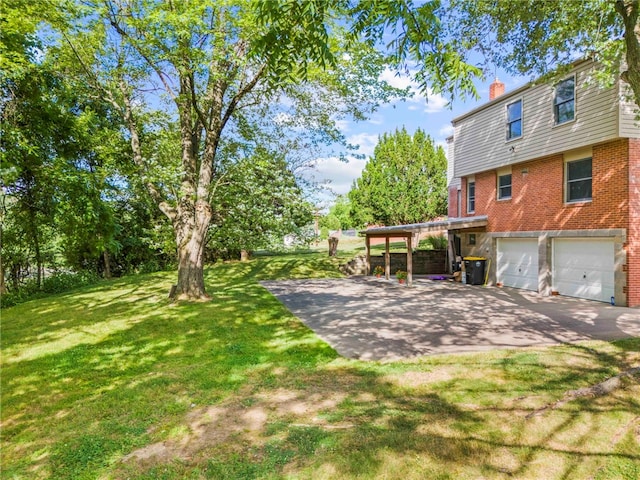 view of yard featuring a garage