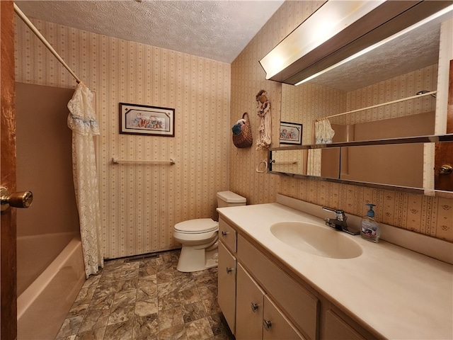 full bathroom featuring toilet, vanity, shower / bath combination with curtain, and a textured ceiling