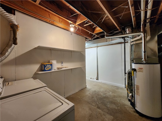 basement featuring water heater and washer and dryer