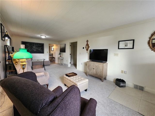 living room featuring ornamental molding and carpet flooring