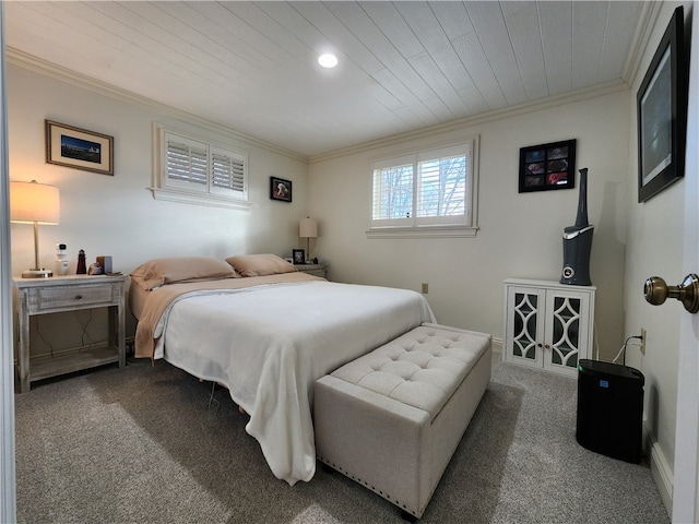 bedroom with dark carpet and crown molding