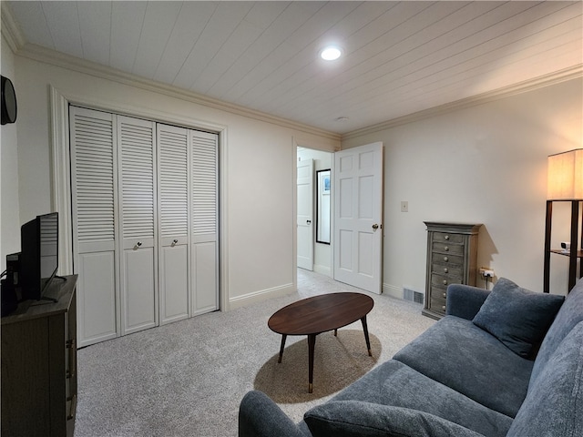 carpeted living room featuring ornamental molding