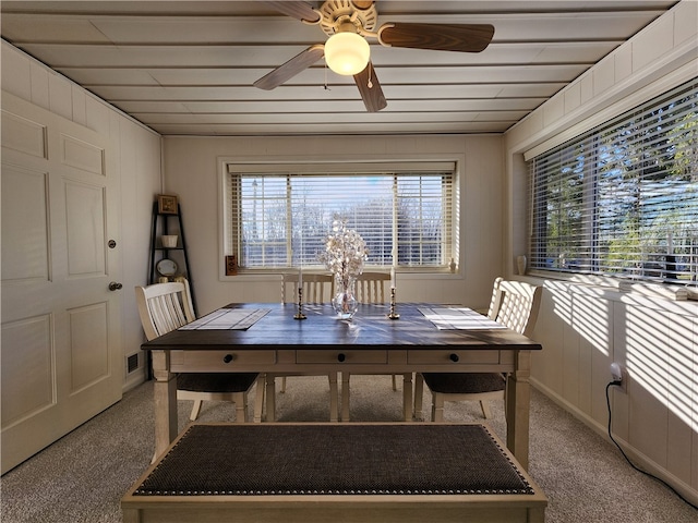 dining area with carpet flooring and ceiling fan