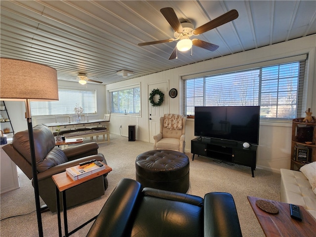 carpeted living room featuring ceiling fan