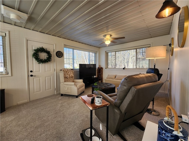 living room featuring carpet and ceiling fan