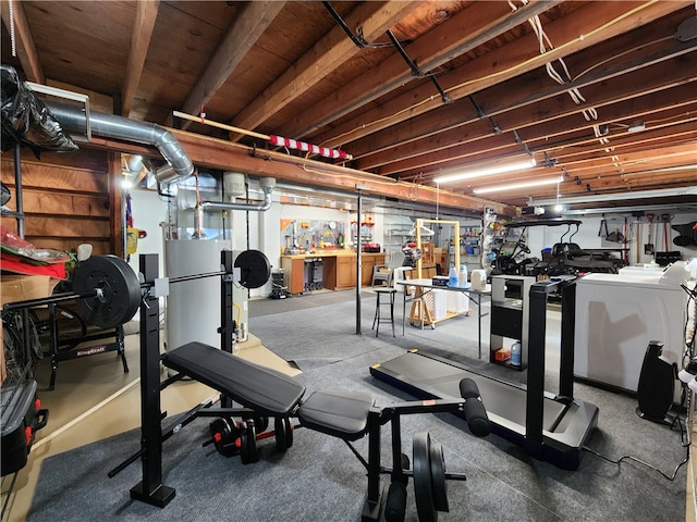 workout area with a workshop area and washing machine and clothes dryer