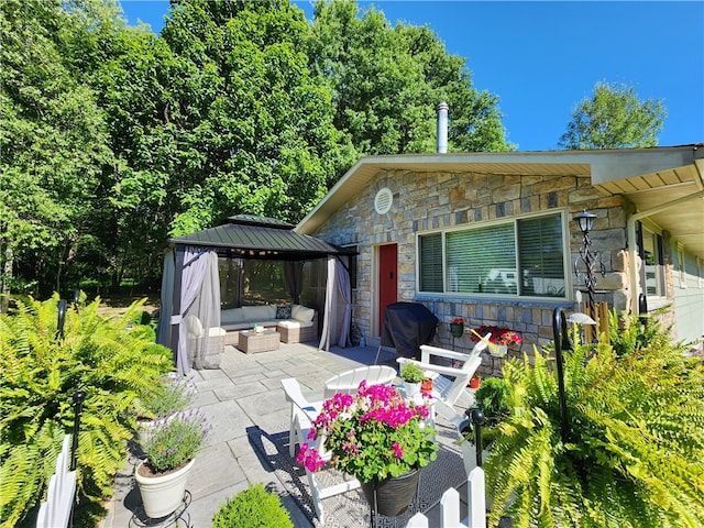 view of patio / terrace featuring a gazebo, grilling area, and an outdoor hangout area