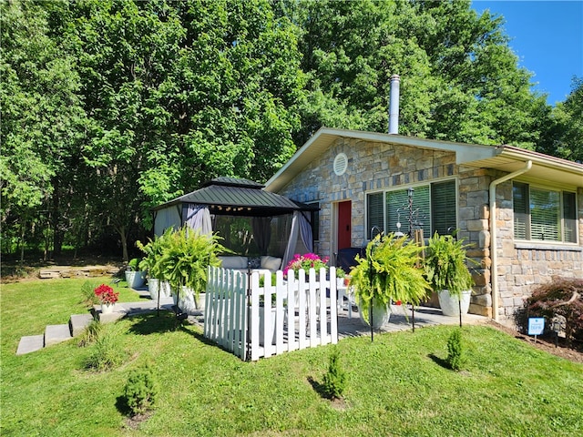 view of home's exterior with a yard