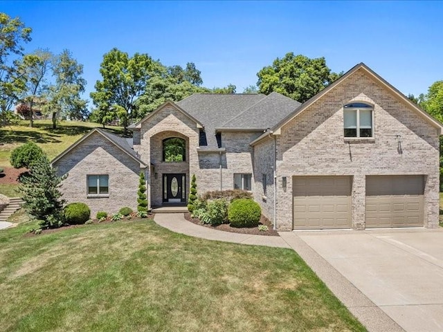 view of front of house with a front lawn and a garage