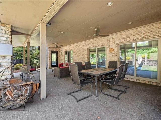 view of patio / terrace with ceiling fan and an outdoor living space