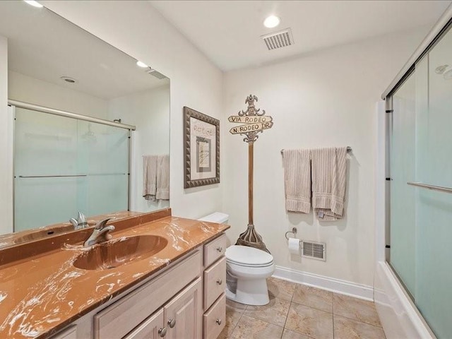 full bathroom with tile patterned flooring, toilet, combined bath / shower with glass door, and vanity