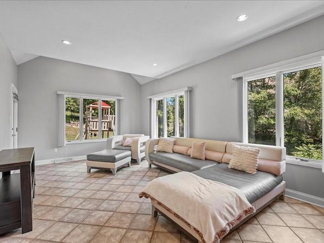 living room featuring light tile patterned floors and lofted ceiling