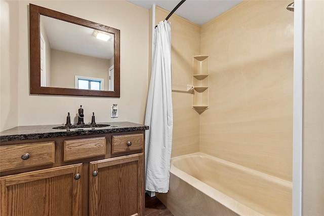 bathroom featuring shower / tub combo and vanity