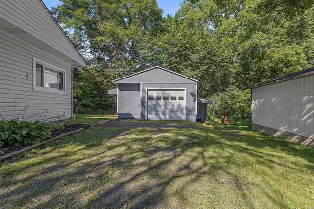 view of yard with an outdoor structure and a garage